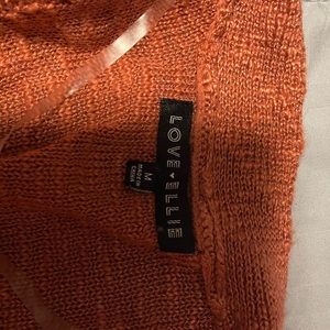 Peach color, small, cardigan.